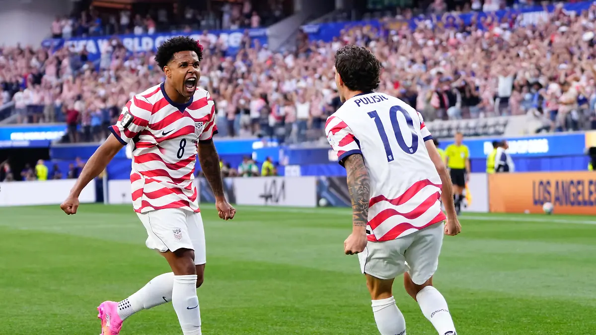 Weston-Mckennie-and-Christian-Pulisic-of-USA-celebrate-an-own-goal-scored-by-Damian-Bobadilla-of-Paraguay-during-the-FIFA-World-Cup-2026-Group-D-match-between-USA-and-Paraguay-at-Los-Angeles-Stadium-on-June-12-2026-in-Los-Angeles-California