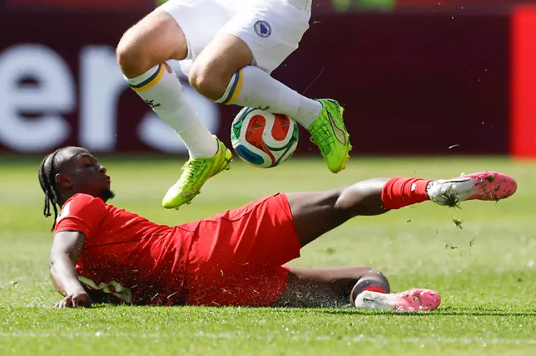 Ismael-Kone-below-of-Canada-vies-for-the-ball-with-Samed-Bazaa-of-Bosnia-and-Herzegovina-in-a-Group-B-match-of-the-2026-FIFA-World-Cup-WM-Weltmeisterschaft-Fussball-between-Canada-and-Bosnia-and-Herzegovina-at-BMO-Field-in-Toronto-Canada-12-June-2026
