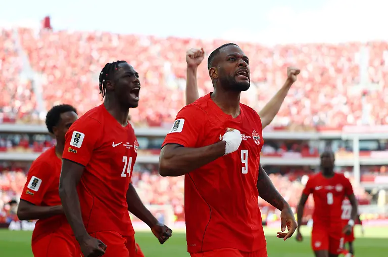 Soccer-Football-FIFA-World-Cup-2026-Group-B-Canada-v-Bosnia-and-Herzegovina-Toronto-Stadium-Toronto-Canada-June-12-2026-Canada-s-Cyle-Larin-celebrates-scoring-their-first-goal-with-Promise-David-REUTERS-Claudia-Greco