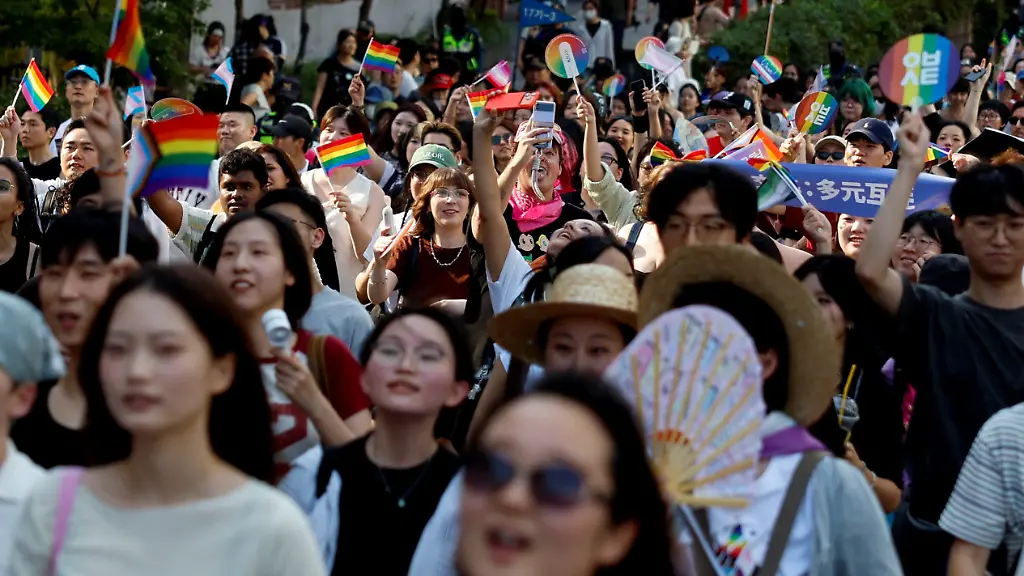 Participants-wave-rainbow-flags-as-South-Korea-s-LGBTQ-community-and-supporters-attend-a-pride-parade-during-the-Seoul-Queer-Culture-Festival-in-Seoul-South-Korea-June-13-2026