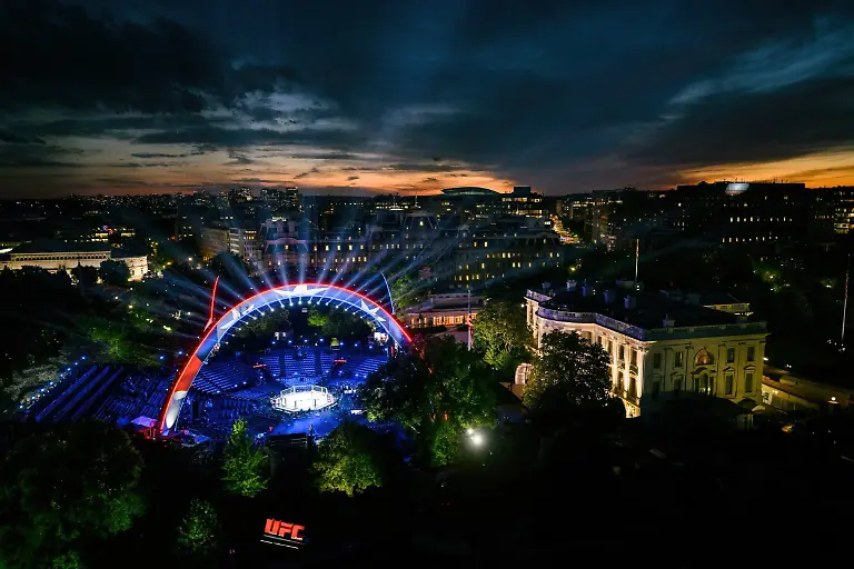 June-14-2026-Washington-Dc-United-States-The-Octagon-fighting-ring-is-illuminated-as-the-sunsets-over-the-White-House-as-final-preparations-are-made-for-the-Ultimate-Fighting-Championship-Freedom-250-June-13-2026-in-Washington-D-C-The-event-is-being-held-as-part-of-birthday-celebrations-for-President-Donald-Trump-and-is-the-first-time-a-commercial-business-has-been-staged-at-the-peopleA-a-a-s-house
