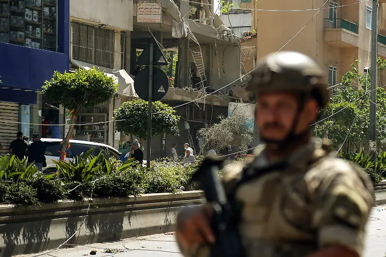 June-14-2026-Beirut-Beirut-Lebanon-A-Lebanese-army-soldier-secures-the-site-where-a-building-was-targeted-by-Israeli-strike-in-Beirut-southern-suburb-a-bastion-of-pro-Iranian-Hezbollah-Three-people-were-killed-in-the-attack-according-to-Lebanon-s-state-media