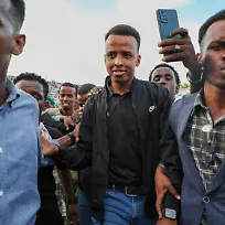 MOGADISHU-SOMALIA-JUNE-10-Somali-referee-Omar-Abdulkadir-Artan-greets-fans-who-show-support-for-him-after-he-was-denied-entry-into-the-United-States-where-he-had-traveled-to-take-part-in-the-World-Cup-organization-and-was-forced-to-return-to-his-country-in-Mogadishu-Somalia-on-June-10-2026