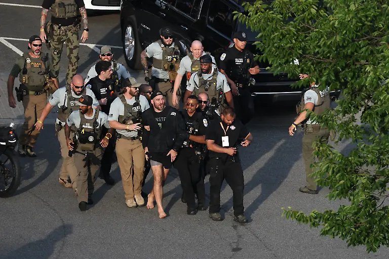 MMA-fighter-Sean-Strickland-is-escorted-out-of-the-UFC-Freedom-250-Fan-Fest-on-The-Ellipse-by-U-S-Secret-Service-and-other-law-enforcement-ahead-of-UFC-Freedom-250-on-the-South-Lawn-of-the-White-House-on-Sunday-June-14-2026-in-Washington