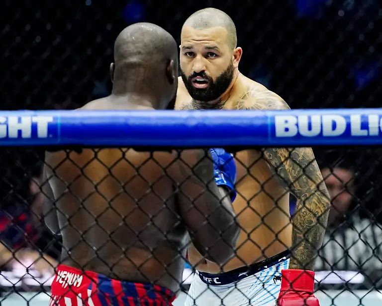 UFC-Heavyweight-Josh-Hokit-R-faces-off-with-Derrick-Lewis-during-the-Freedom-250-UFC-fight-card-on-the-South-Lawn-of-the-White-House-in-Washington-DC-on-Sunday-June-14-2026-The-mixed-martial-arts-bouts-are-being-held-as-part-of-President-Trump-s-80th-birthday-weekend-activities