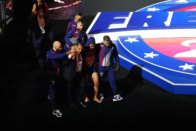 Ilia-Topuria-is-helped-out-of-the-stadium-after-being-defeated-by-Justin-Gaethje-in-a-lightweight-title-bout-during-UFC-Freedom-250-on-the-South-Lawn-of-the-White-House-Monday-June-15-2026-in-Washington