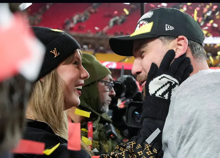 Kansas-City-Chiefs-tight-end-Travis-Kelce-and-his-girlfriend-entertainer-Taylor-Swift-stand-on-the-field-after-the-Chiefs-defeated-the-Buffalo-Bills-32-29-in-the-AFC-Championship-Game-at-Arrowhead-Stadium-in-Kansas-City-Missouri-on-Sunday-January-26-2025-The-Chiefs-will-meet-the-Philadelphia-Eagles-in-Super-Bowl-LIX-in-New-Orleans-on-February-9