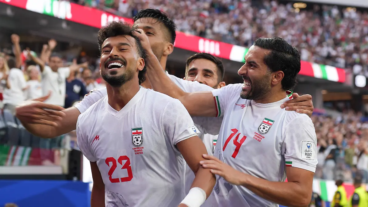 Ramin-Rezaeian-L-and-Saman-Ghoddos-R-of-Iran-celebrate-a-goal-during-a-Group-G-match-of-the-2026-FIFA-World-Cup-between-Iran-and-New-Zealand-at-SoFi-Stadium-in-Los-Angeles-USA-15-June-2026