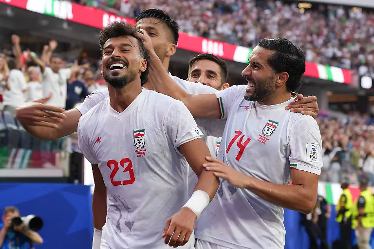 Ramin-Rezaeian-L-and-Saman-Ghoddos-R-of-Iran-celebrate-a-goal-during-a-Group-G-match-of-the-2026-FIFA-World-Cup-between-Iran-and-New-Zealand-at-SoFi-Stadium-in-Los-Angeles-USA-15-June-2026
