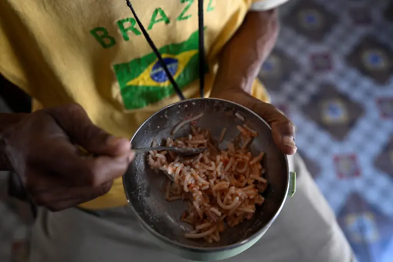 Sagrado-Armando-Garcia-85-a-retired-government-bureaucrat-writing-a-book-on-a-borrowed-laptop-eats-lunch-at-home-in-Havana-Cuba-April-28-2026-Cuba-has-struggled-for-years-under-U-S-sanctions-to-provide-basic-services-Garcia-said-he-has-faced-worsening-shortages-of-food-in-recent-months-leaving-him-at-times-dizzy-with-hunger-They-are-leaving-us-to-our-fate-he-said-REUTERS-Norlys-Perez-SEARCH-NORLYS-CUBA-ELDERLY-FOR-THIS-STORY-SEARCH-WIDER-IMAGE-FOR-ALL-STORIES