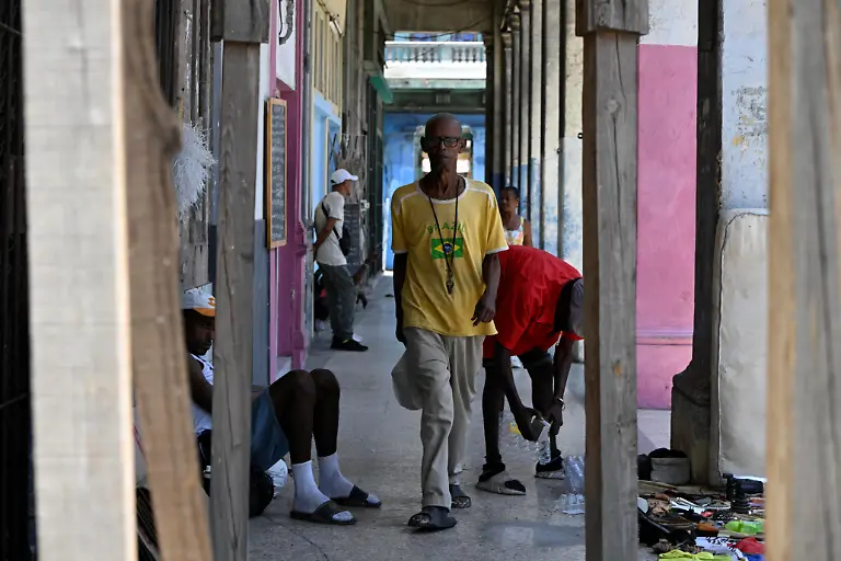 Sagrado-Armando-Garcia-85-a-retired-government-bureaucrat-walks-home-from-a-state-run-dining-hall-that-provides-rations-to-the-people-in-need-in-Havana-Cuba-April-28-2026-Garcia-spent-decades-working-at-Cuba-s-Ministry-of-Social-Security-believing-in-a-system-that-promised-to-shield-people-in-old-age-That-sense-of-security-has-vanished-as-Cuba-has-struggled-for-years-under-U-S-sanctions-to-provide-basic-services-with-seniors-now-facing-harsher-conditions-after-the-Trump-administration-s-move-to-cut-off-the-island-s-fuel-supply-REUTERS-Norlys-Perez-TPX-IMAGES-OF-THE-DAY-SEARCH-NORLYS-CUBA-ELDERLY-FOR-THIS-STORY-SEARCH-WIDER-IMAGE-FOR-ALL-STORIES