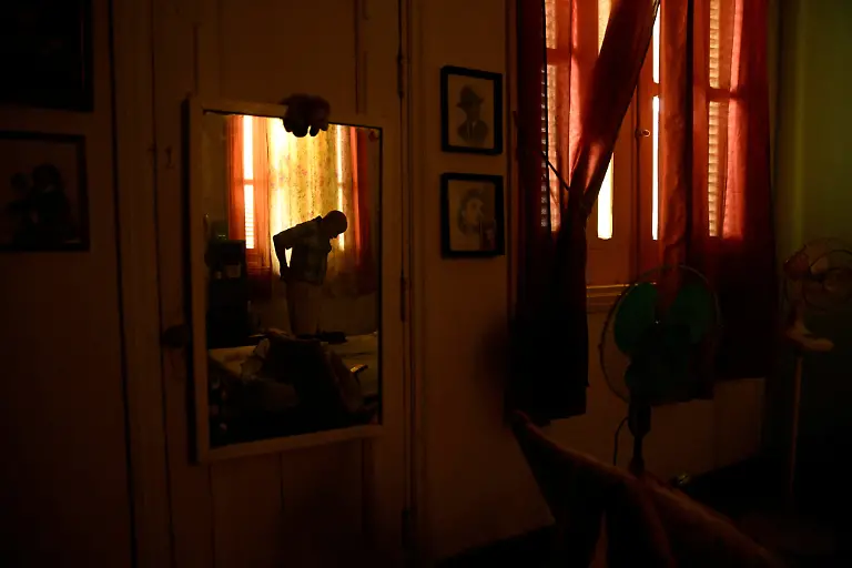 Renato-Lombard-74-a-pensioned-taxi-driver-whose-three-children-live-in-the-United-States-gets-dressed-in-his-bedroom-during-a-blackout-in-the-home-he-shares-with-his-wife-in-Havana-Cuba-September-24-2025-Blackouts-have-become-common-in-Cuba-amid-a-worsening-energy-crisis-A-U-N-World-Food-Programme-representative-said-older-Cubans-are-now-a-very-high-risk-population-REUTERS-Norlys-Perez-SEARCH-NORLYS-CUBA-ELDERLY-FOR-THIS-STORY-SEARCH-WIDER-IMAGE-FOR-ALL-STORIES