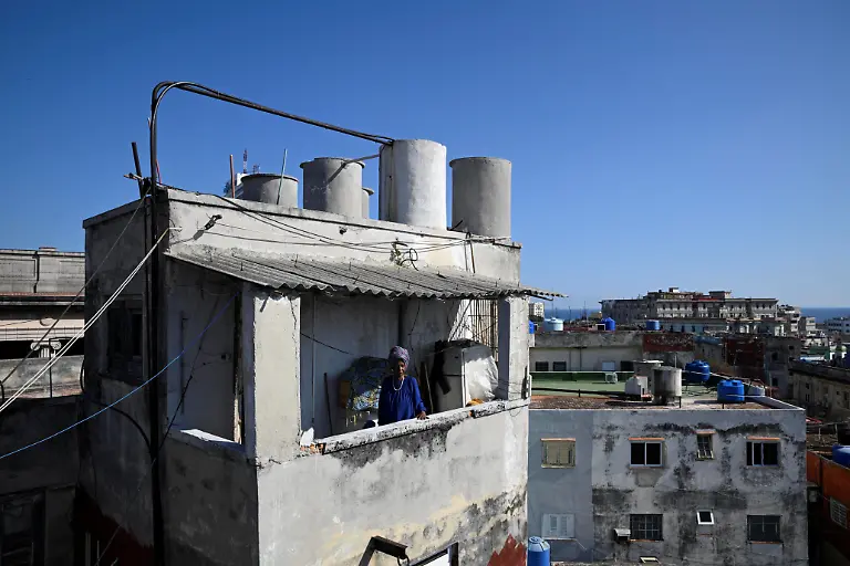 Regina-Zaida-Jorge-74-a-pensioner-stands-on-the-balcony-of-her-apartment-in-Havana-Cuba-April-29-2026-Jorge-lives-alone-and-relies-on-church-groups-for-food-Cuba-the-fastest-aging-nation-in-Latin-America-and-the-Caribbean-has-struggled-for-years-under-U-S-sanctions-to-provide-basic-services-with-seniors-now-facing-harsher-conditions-after-a-Trump-administration-move-to-cut-off-the-island-s-fuel-supply-REUTERS-Norlys-Perez-TPX-IMAGES-OF-THE-DAY-SEARCH-NORLYS-CUBA-ELDERLY-FOR-THIS-STORY-SEARCH-WIDER-IMAGE-FOR-ALL-STORIES