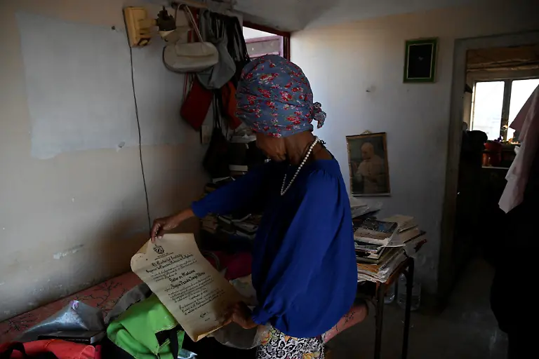 Regina-Zaida-Jorge-74-a-pensioner-who-lives-alone-and-relies-on-church-groups-for-food-shows-her-medical-diploma-at-her-home-in-Havana-Cuba-April-29-2026-Jorge-said-she-had-given-everything-as-a-low-paid-state-worker-to-a-system-incapable-of-providing-her-with-necessities-as-basic-as-a-bar-of-soap-REUTERS-Norlys-Perez-SEARCH-NORLYS-CUBA-ELDERLY-FOR-THIS-STORY-SEARCH-WIDER-IMAGE-FOR-ALL-STORIES