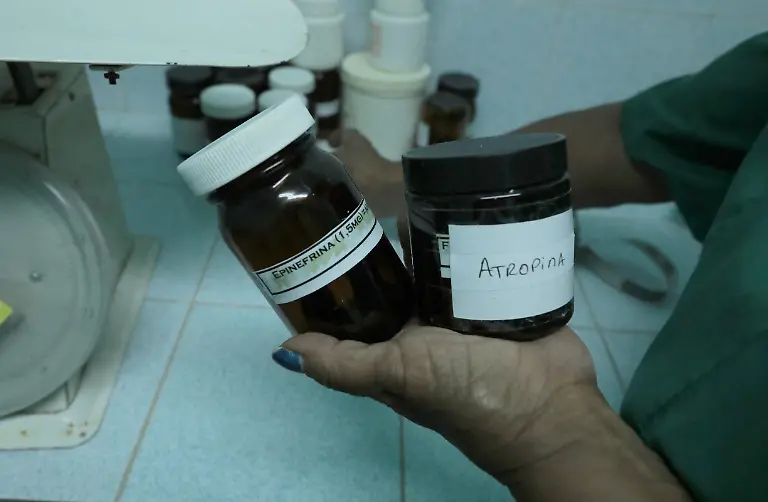 A-nurse-showing-medicine-used-in-a-health-center-in-Havana-Cuba-March-24-2026-The-health-care-system-is-public-it-is-free-and-it-stil-functions-in-Cuba-but-with-great-difficulties-The-US-has-imposed-an-economic-embargo-on-Cuba-since-1962-which-has-been-straining-imports-of-medicine-and-equipment-This-embargo-has-been-reenforced-since-the-US-intervention-in-Venezuela-in-January-2026-The-US-has-cut-off-Cuba-from-its-principal-petrol-supplier-and-is-menacing-with-tariffs-any-other-country-trading-with-Cuba-This-has-resulted-in-the-most-serious-economic-and-political-crisis-in-the-history-of-the-island-Une-infirmiere-montre-des-medicaments-utilises-dans-un-centre-de-sante-de-La-Havane-Cuba-le-24-mars-2026-Le-systeme-de-sante-est-gratuit-et-fonctionne-a-Cuba-mais-il-fait-face-a-de-grandes-difficultes-Les-Etats-Unis-imposent-un-embargo-economique-a-Cuba-depuis-1962-ce-qui-cause-des-perturbations-sur-les-chaines-d-importation-en-medicaments-et-en-equipements-Cet-embargo-a-ete-renforce-depuis-l-intervention-americaine-au-Venezuela-en-janvier-2026-Les-Etats-Unis-ont-coupe-Cuba-de-son-principal-fournisseur-de-petrole-et-menacent-d-imposer-des-droits-de-douane-a-tout-autre-pays-qui-commerce-avec-l-ile-Cela-provoque-la-pire-crise-economique-et-politique-de-l-histoire-de-l-ile