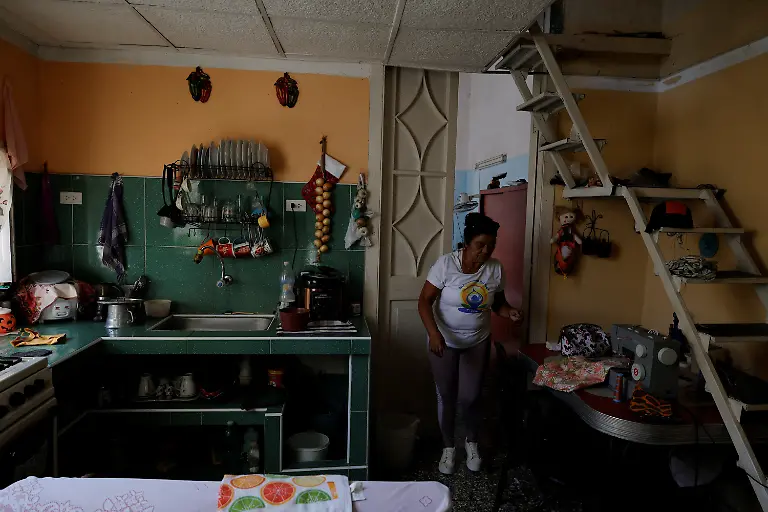 Sonia-Belmonte-73-a-pensioner-walks-near-a-sewing-machine-in-the-kitchen-of-her-home-in-Havana-Cuba-May-6-2026-Belmonte-receives-about-100-a-month-from-a-daughter-in-Florida-helping-cover-basic-needs-I-can-treat-myself-now-and-then-and-eat-well-REUTERS-Norlys-Perez-SEARCH-NORLYS-CUBA-ELDERLY-FOR-THIS-STORY-SEARCH-WIDER-IMAGE-FOR-ALL-STORIES