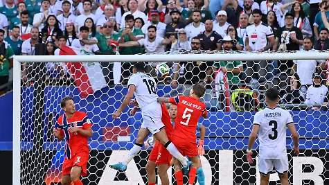 Iraq-forward-Ayman-Hussein-18-scores-a-goal-against-Norway-goalkeeper-Orjan-Nyland-1-during-the-first-half-at-the-FIFA-World-Cup-2026-match-at-Boston-Stadium-in-Foxborough-Massachusetts-on-June-16-2026
