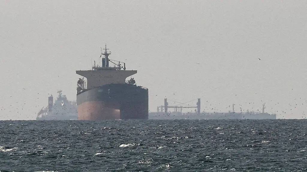 FILE-PHOTO-Cargo-ships-in-the-Gulf-near-the-Strait-of-Hormuz-as-seen-from-northern-Ras-al-Khaimah-near-the-border-with-Oman-s-Musandam-governance-amid-the-U-S-Israeli-conflict-with-Iran-in-United-Arab-Emirates-March-11-2026