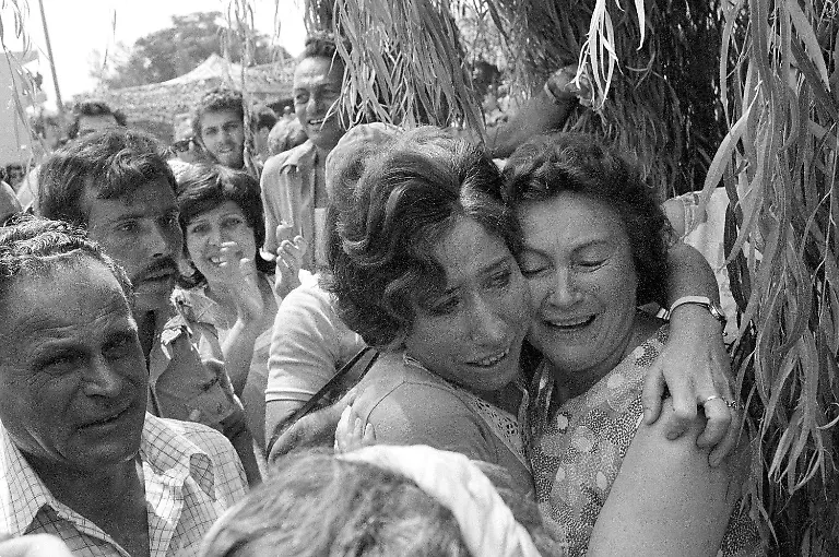 A-mother-and-her-daughter-embrace-when-the-latter-arrived-at-Tel-Aviv-s-Ben-Gurion-Airport-after-Israeli-paratroopers-freed-her-and-other-hostages-aboard-a-Air-France-jet-at-Uganda-s-Entebbe-Airport-earlier-in-the-day-July-4-1976