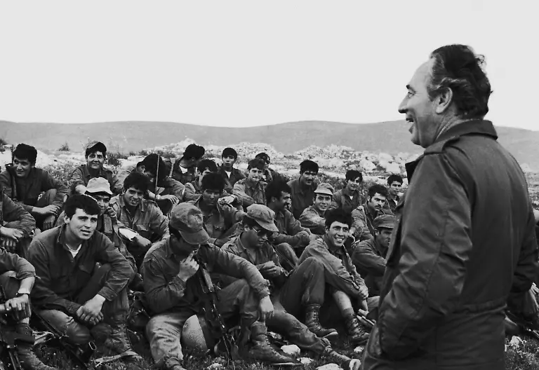 Israeli-Defence-Minister-Shimon-Peres-right-addresses-Israeli-paratroops-after-the-completion-of-Operation-Entebbe-July-1976-The-raid-took-place-on-3rd-July-1976-and-resulted-in-the-rescue-by-Israeli-special-forces-of-100-hostages-held-at-Entebbe-Airport-in-Uganda-by-members-of-the-Popular-Front-for-the-Liberation-of-Palestine