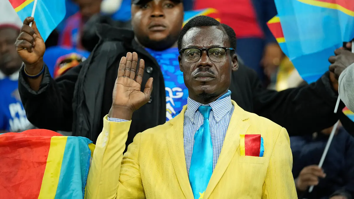 FILE-Michel-Nkuka-Mboladinga-a-DR-Congo-fan-impersonating-late-Congolese-leader-Patrice-Lumumba-strikes-a-pose-during-the-Africa-Cup-of-Nations-group-D-soccer-match-between-Botswana-and-DR-Congo-in-Rabat-Morocco-Tuesday-Dec-30-2025