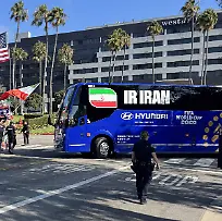 Iran-national-team-leaves-Los-Angeles-hotel-under-heavy-security-amid-protests-LOS-ANGELES-UNITED-STATES-JUNE-14-Demonstrators-gather-outside-the-hotel-where-the-Iran-national-football-team-is-staying-ahead-of-its-opening-Group-G-match-against-New-Zealand-at-the-2026-FIFA-World-Cup-in-Los-Angeles-California-United-States-on-June-14-2026-Protesters-carrying-Iran-s-former-Lion-and-Sun-flag-as-well-as-U-S-and-Israeli-flags-demonstrated-near-the-team-hotel-after-learning-of-the-squad-s-arrival-in-the-city-Bozhan-Memis-Anadolu-California-United-States-Editorial-use-only-Please-get-in-touch-for-any-other-usage