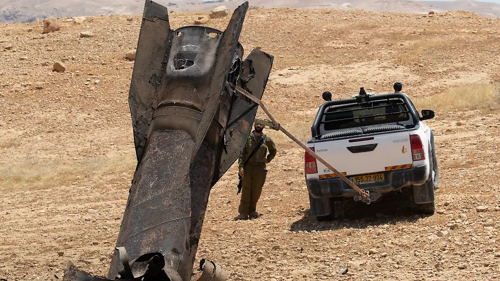 An-Israeli-soldier-watches-as-they-begin-to-remove-an-Iranian-ballistic-missile-sticking-out-from-the-desert-landscape-in-the-area-near-Jericho-in-the-West-Bank-on-Monday-June-8-2026-after-it-was-intercepted-by-Israel-and-fell-to-the-desert-Iran-fired-barrages-of-missiles-and-Israel-carried-out-military-strikes-on-both-Beirut-and-Iran-Both-Iran-and-Israel-have-signaled-they-would-wind-down-the-military-escalation-that-shattered-the-two-month-ceasefire