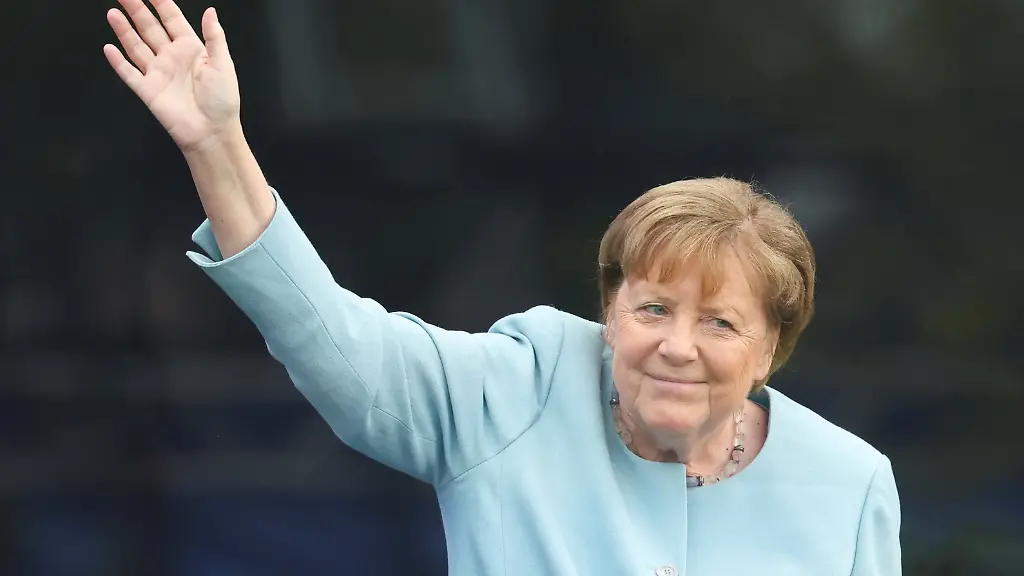 Former-German-Chancellor-Angela-Merkel-waves-during-a-dedication-ceremony-for-the-opening-of-the-Obama-Presidential-Center-in-Chicago-Illinois-U-S-June-18-2026