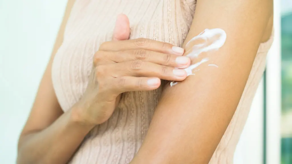 Woman-applying-Moisturizer-cream-body-lotion-to-hand-after-bath-in-home-for-sun-protection-skin-care-youthful-looking-skin-cosmetic-for-beauty-slim-fit-girl-and-skin-tan