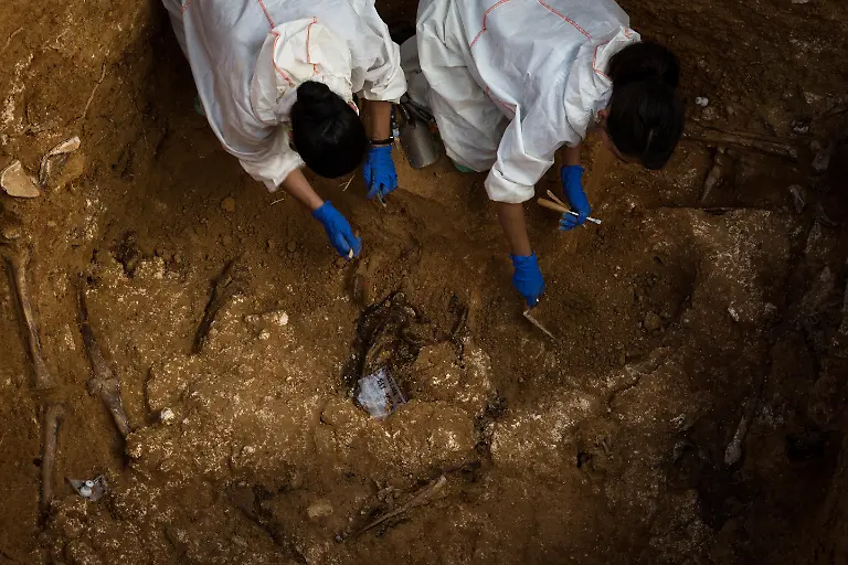 VALENCIA-SPAIN-JUNE-01-A-mass-grave-area-is-being-dug-after-the-judge-of-guard-of-Paterna-judicialized-the-exhumations-of-the-113-common-pit-after-finding-12-bodies-of-reprisals-of-the-Franco-regime-in-Paterna-region-of-Valencia-Spain-on-June-01-2017-The-mass-grave-is-the-largest-one-which-contains-the-remains-of-the-people-who-were-executed-by-gunfire-on-the-ruling-period-of-Spanish-dictator-Francisco-Franco-between-the-years-of-January-01-1940-and-September-19-1941