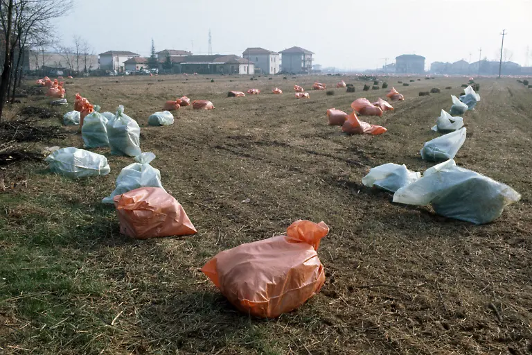 Toxic-waste-from-zone-A-is-packed-into-bags-for-removal-in-November-1976-after-a-chemical-accident-at-the-chemical-manufacturing-plant-Icmesa-near-Seveso-Italy-On-July-10-1976-a-reactor-explosion-takes-place-at-Icmesa-an-affiliate-of-Givaudan-at-the-periphery-of-the-municipality-of-Meda-near-Milan-in-which-a-cloud-of-dioxin-is-released-The-wind-subsequently-spreads-the-poison-across-a-large-area-and-the-cloud-descends-over-the-neighboring-municipality-of-Seveso