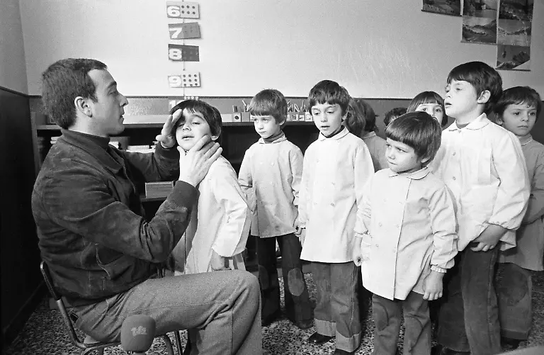 A-doctor-examines-children-with-eczema-as-a-result-of-the-chemical-accident-which-took-place-at-the-chemical-manufacturing-plant-Icmesa-pictured-on-February-7-1977-at-a-school-in-Seveso-Italy-On-July-10-1976-a-reactor-explosion-takes-place-at-Icmesa-an-affiliate-of-Givaudan-at-the-periphery-of-the-municipality-of-Meda-near-Milan-in-which-a-cloud-of-dioxin-is-released-The-wind-subsequently-spreads-the-poison-across-a-large-area-and-the-cloud-descends-over-the-neighboring-municipality-of-Seveso