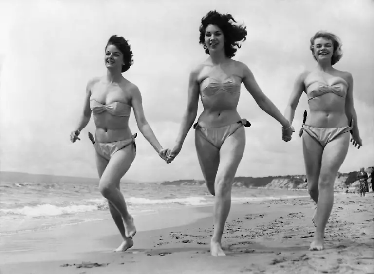 A-dip-in-the-sea-is-something-like-a-busman-s-holiday-for-these-bikini-clad-girls-who-are-appearing-in-the-Aqua-Show-at-Bournemouth