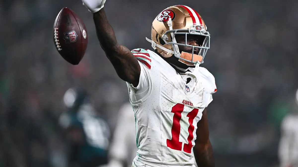 PHILADELPHIA-PA-DECEMBER-03-San-Francisco-49ers-Wide-Receiver-Brandon-Aiyuk-11-drops-the-ball-after-a-reception-in-the-first-half-during-the-game-between-the-San-Francisco-49ers-and-Philadelphia-Eagles-on-December-03-2023-at-Lincoln-Financial-Field-in-Philadelphia-PA