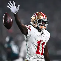 PHILADELPHIA-PA-DECEMBER-03-San-Francisco-49ers-Wide-Receiver-Brandon-Aiyuk-11-drops-the-ball-after-a-reception-in-the-first-half-during-the-game-between-the-San-Francisco-49ers-and-Philadelphia-Eagles-on-December-03-2023-at-Lincoln-Financial-Field-in-Philadelphia-PA