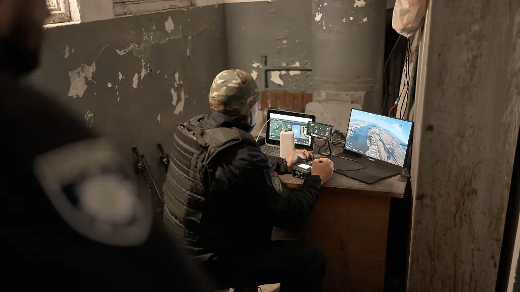 KHERSON-UKRAINE-APRIL-5-Police-officers-from-the-special-unit-Kavuny-Watermelons-inspect-the-sky-and-use-a-drone-with-an-ordinary-stick-attached-to-it-to-knock-down-Russian-Mavic-3-type-drones-in-Kherson-on-April-5-2026-in-Kherson-Ukraine-Fighting-between-Ukrainian-and-Russian-forces-has-intensified-around-the-frontline-port-city-of-Kherson-in-recent-days-with-reports-of-Russian-drone-attacks-targeting-civilians