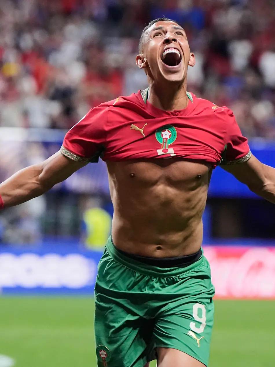 Fussball-Maenner-WM-Vorrunde-Gruppe-C-3-Spieltag-Marokko-Haiti-Der-Marokkaner-Soufiane-Rahimi-9-jubelt-nachdem-er-das-dritte-Tor-seiner-Mannschaft-erzielt-hat