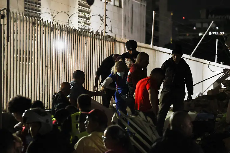 People-gather-at-the-site-of-a-collapsed-building-after-an-earthquake-in-Caracas-Venezuela-June-24-2026