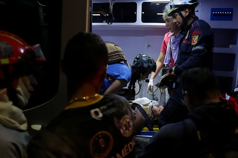A-man-rescued-from-a-collapsed-building-is-attended-to-inside-an-ambulance-after-an-earthquake-in-Caracas-Venezuela-June-24-2026