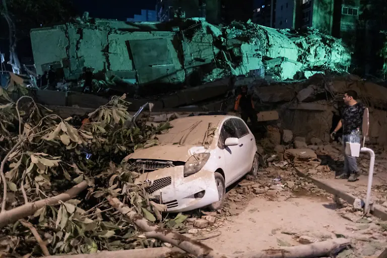 CARACAS-VENEZUELA-JUNE-24-A-damaged-vehicle-is-seen-amid-debris-near-a-collapsed-building-following-a-powerful-earthquake-in-Caracas-Venezuela-on-June-24-2026-Venezuela-declared-a-national-state-of-emergency-after-twin-earthquakes-measuring-7-2-and-7-5-in-magnitude-struck-the-country-s-northern-Caribbean-coast-causing-widespread-destruction-disrupting-transportation-and-prompting-tsunami-warnings-across-the-region