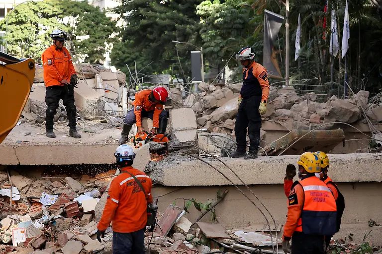 Emergency-services-work-at-the-site-of-a-collapsed-building-after-earthquakes-hit-the-country-in-Caracas-Venezuela-June-25-2026
