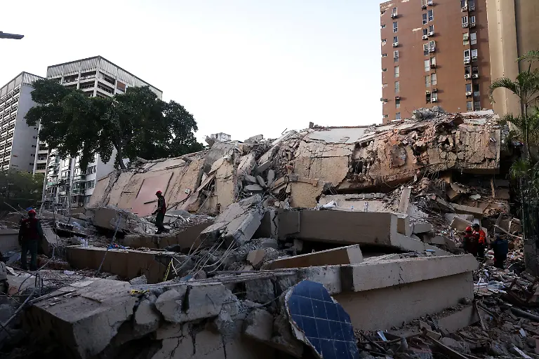 Emergency-services-work-at-the-site-of-a-collapsed-building-after-earthquakes-hit-the-country-in-Caracas-Venezuela-June-25-2026