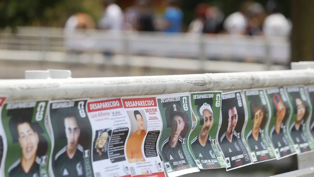 Activists-in-Guadalajara-replace-World-Cup-football-stickers-with-images-of-missing-people-to-raise-awareness-GUADALAJARA-MEXICO-JUNE-07-Families-and-activists-from-the-Colectivo-Luz-de-Esperanza-Jalisco-place-modified-designs-of-traditional-collectible-football-stickers-where-photos-of-missing-persons-have-replaced-the-images-of-football-players-to-raise-awareness-on-iron-railings-during-a-demonstration-to-search-for-missing-people-a-few-days-before-the-start-of-the-2026-FIFA-World-Cup-in-Guadalajara-Mexico-on-Sunday-June-07-2026-Stringer-Anadolu-Guadalajara-Mexico-Editorial-use-only-Please-get-in-touch-for-any-other-usage