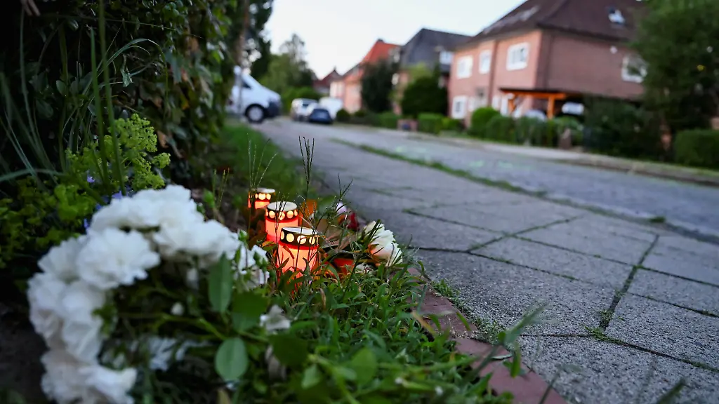 Flowers-and-candles-sit-in-the-ground-near-the-scene-after-a-deadly-shooting-at-a-youth-welfare-facility-in-the-northern-town-of-Stade-Germany-June-29-2026