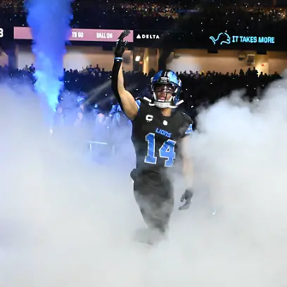 DETROIT-MI-DECEMBER-15-Detroit-Lions-wide-receiver-Amon-Ra-St-Brown-14-is-introduced-during-pregame-ceremonies-prior-to-the-Detroit-Lions-versus-the-Buffalo-Bills-game-on-Sunday-December-15-2024-at-Ford-Field-in-Detroit-MI