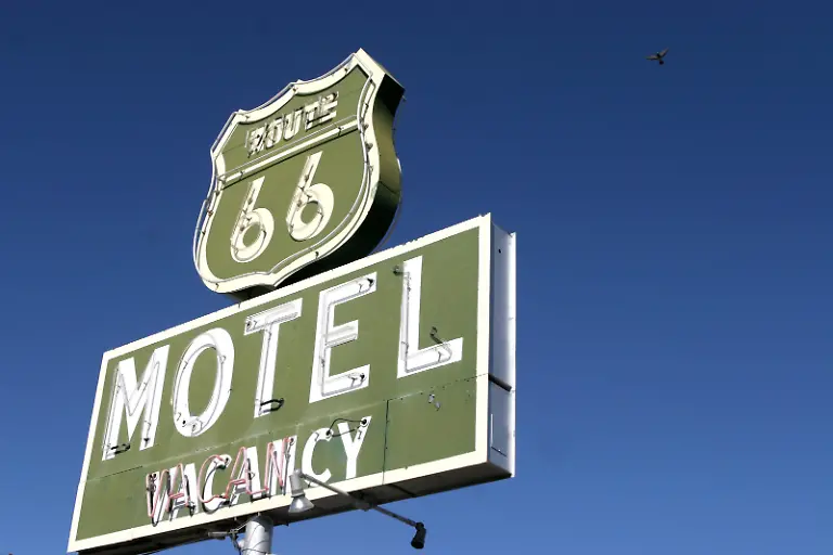 Marianna-Day-Massey-ZUMA-PRESS-MAXPPP-Barstow-USA-20060924-Sep-24-2006-Barstow-CA-USA-U-S-Route-66-also-known-as-Route-66-or-Will-Rogers-Highway-was-a-highway-in-the-U-S-Highway-system-One-of-the-original-federal-routes-US-66-was-established-on-November-11-1926-though-signs-did-not-go-up-until-the-following-year-It-originally-ran-from-Chicago-Illinois-through-St-Louis-Missouri-Kansas-Oklahoma-Texas-New-Mexico-Arizona-and-California-before-ending-at-Los-Angeles-for-a-total-of-2-448-miles-3-939-km-Route-66-underwent-many-improvements-and-realignments-One-of-those-resulted-in-the-movement-of-the-endpoint-from-Los-Angeles-to-Santa-Monica-Contrary-to-common-belief-Route-66-never-ran-to-the-ocean-it-terminated-onto-what-was-then-US-101-at-the-intersection-of-what-is-today-Lincoln-Boulevard-and-Olympic-Boulevard-Route-66-was-a-major-migratory-path-west-especially-during-the-Dust-Bowl-of-the-1930s-and-supported-the-economies-of-the-communities-through-which-the-road-passed-People-became-prosperous-due-to-the-growing-popularity-of-the-highway-and-those-same-people-later-fought-to-keep-the-highway-alive-even-with-the-growing-threat-of-the-new-Interstate-Highway-System-US-66-was-officially-decommissioned-that-is-officially-removed-from-the-United-States-Highway-System-on-June-27-1985-after-it-was-decided-the-route-was-no-longer-relevant-and-had-been-replaced-by-the-Interstate-Highway-System-Portions-of-the-road-that-pass-through-Illinois-New-Mexico-Arizona-California-have-been-designated-a-National-Scenic-Byway-of-the-name-Historic-Route-66-Pictured-Route-66-motel-in-Barstow-Mandatory-Credit-Photo-by-Marianna-Day-Massey-ZUMA-Press