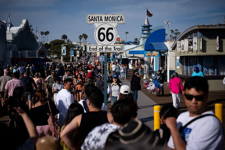 Visitors-pose-for-pictures-at-the-Santa-Monica-Pier-where-Route-66-ends-on-June-1-2025-in-Santa-Monica-California-E