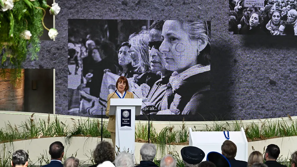 MIDDELBURG-NETHERLANDS-APRIL-16-Gisele-Pelicot-receives-the-Freedom-from-Fear-Award-from-Olcay-Gulsen-during-the-Four-Freedoms-Awards-ceremony-recognizing-contributions-to-human-rights-and-freedom-in-Middelburg-Netherlands-on-April-16-2026