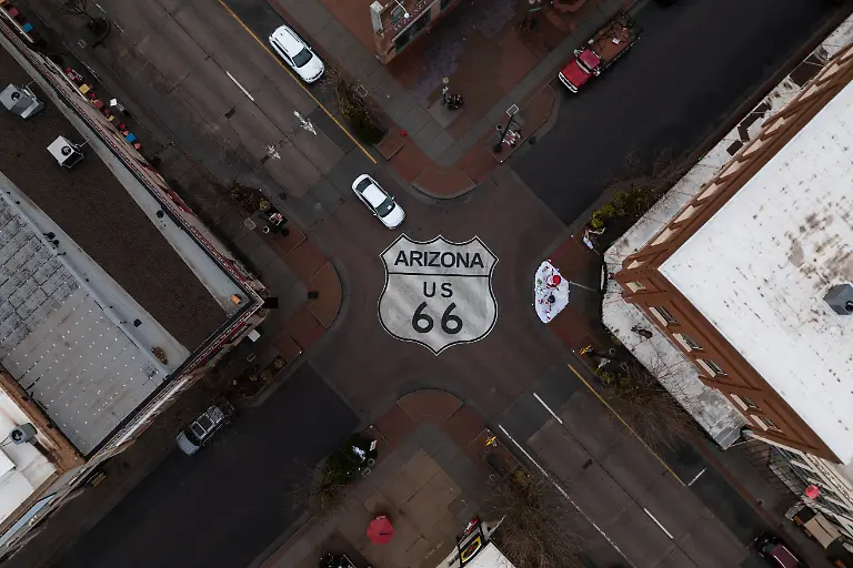 Motorists-travel-through-an-intersection-marked-with-a-U-S-66-shield-in-Winslow-Ariz-a-town-on-the-historic-highway-Thursday-Nov-20-2025-AP-Photo-Jae-C