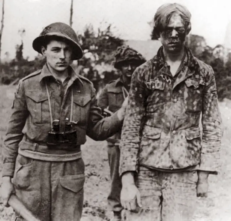 Photograph-of-a-captured-Hitler-Youth-member-with-Canadian-soldiers